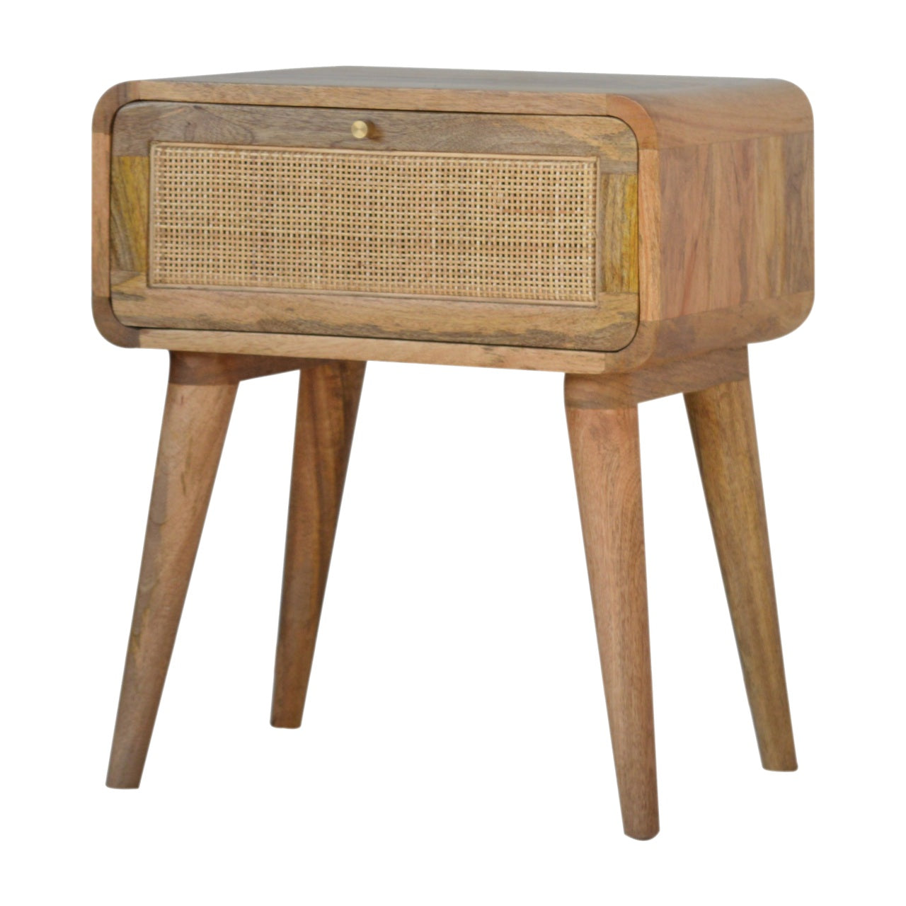 Bedside Close-knit Maple Manor bedside table in solid wood mango with woven cane front, on four legs.