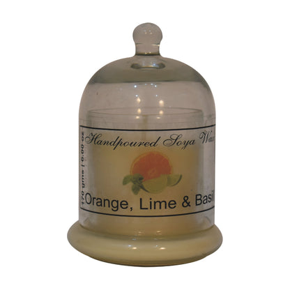 dome-shaped jar with a lime & basil candle inside. set on a white background