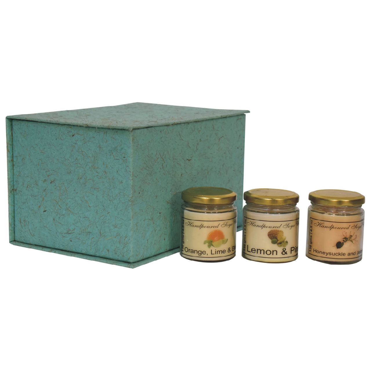 Set of 3 scented candles, includes Orange, Lime & Basil, Lemon & Pine and Honeysuckle & Jasmine. set in front of a gift box on a white background